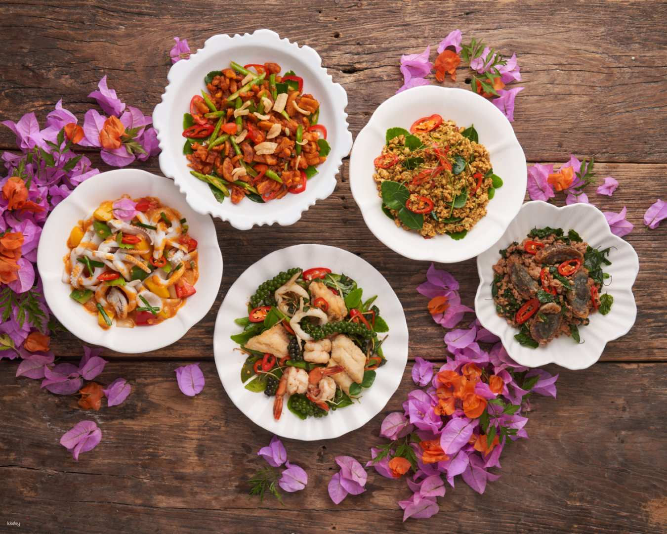 Indulge in an array of authentic Thai dishes showcasing seasonal ingredients and clever twists all while surrounded by stunning decor and blooming flowers perfect for a memorable dining experience.