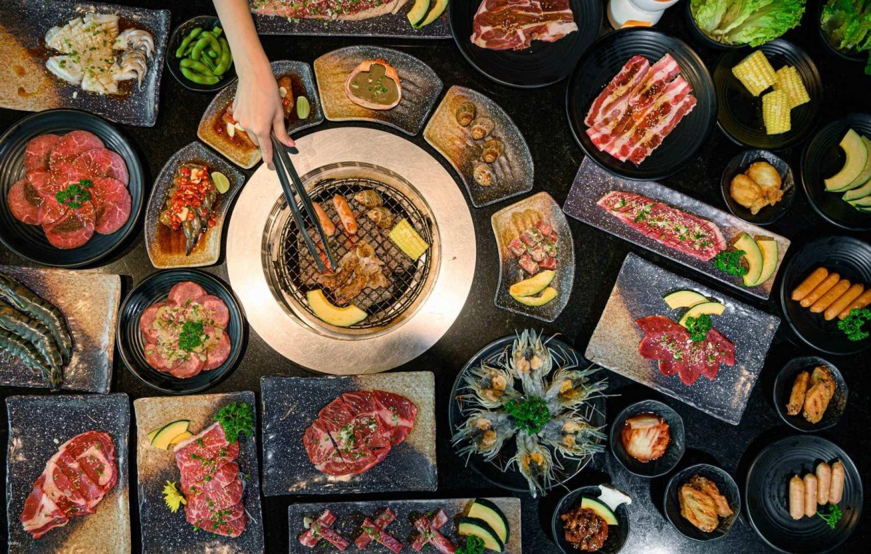Indulge in a BBQ feast with a rich selection of premium meats fresh prawns and delightful sides perfect for gatherings and memorable dining experiences in Bangkok.