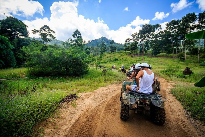 Experience the lush landscapes of Koh Samui as you navigate secluded trails and discover hidden waterfalls on an unforgettable quad biking adventure through the island's stunning terrain.
