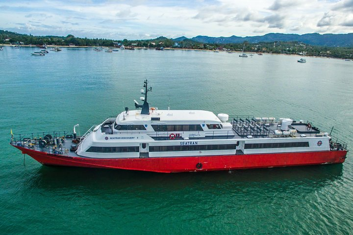 Experience the scenic journey from Koh Samui to Koh Phangan aboard the Seatran Discovery ferry enjoying comfortable seating and stunning views as you glide across the turquoise waters.