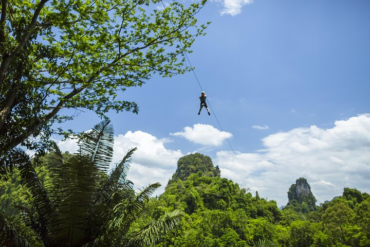 Soaring high above Krabi's lush forests and limestone cliffs experience a unique adventure as you zipline through stunning landscapes creating memories in nature's playground.