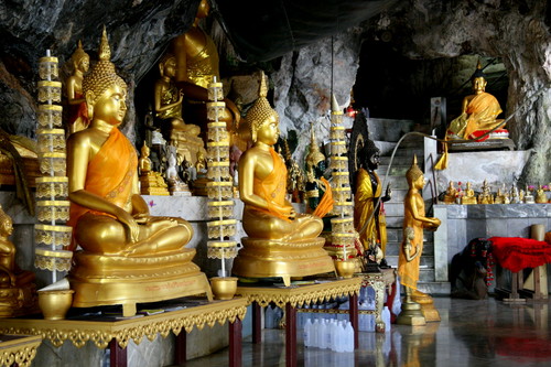 Explore the serene beauty of Tiger Cave Temple adorned with golden statues and intricate details offering a unique glimpse into Buddhist culture and art in Krabi.