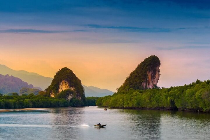 Explore the serene beauty of Krabi's mangrove forests and iconic twin mountains where nature unfolds its secrets along a private boat journey and fascinating cave adventures await.