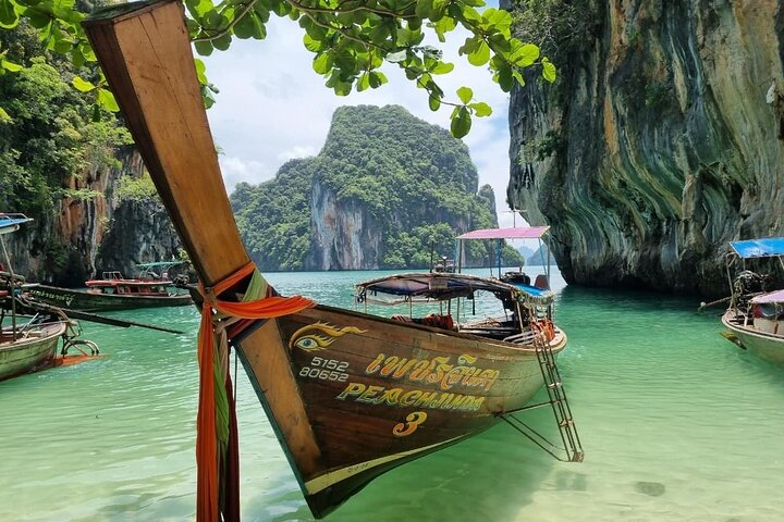 Discover breathtaking views as you glide by stunning limestone cliffs and crystal-clear waters exploring hidden coves and enjoying sun-soaked moments on Hong Island's pristine shores.