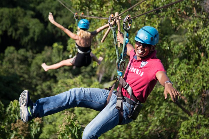 Experience the rush of zip lining between mountains while soaking in stunning views of Koh Samui's coastline. Relax afterward at the Lamai Viewpoint bar with friends and family.