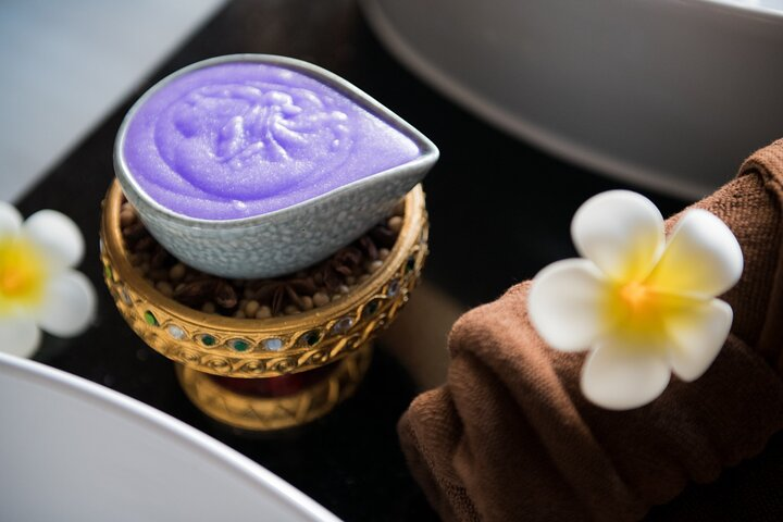 Experience unparalleled relaxation with soothing aroma oils and herbal compresses set against the serene backdrop of an elegant spa inviting travelers to unwind amidst luxury in Bangkok.