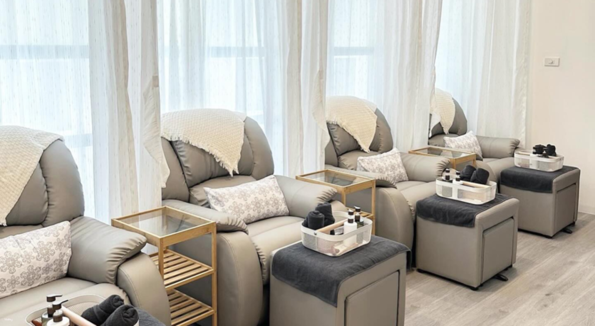 Experience relaxation in a serene setting with plush seating and subtle decor where expert therapists ensure ultimate comfort and rejuvenation during your time in Bangkok.