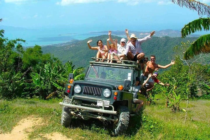 Experience the rugged beauty of Koh Samui as you journey through lush jungles and stunning viewpoints in ex-army jeeps creating unforgettable memories with fellow adventurers.