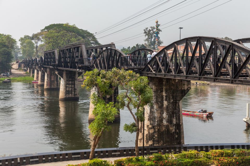 Experience the stunning landscapes of Kanchanaburi Province from the comfort of your private car with scenic routes leading to iconic landmarks like the historic bridge over the river.