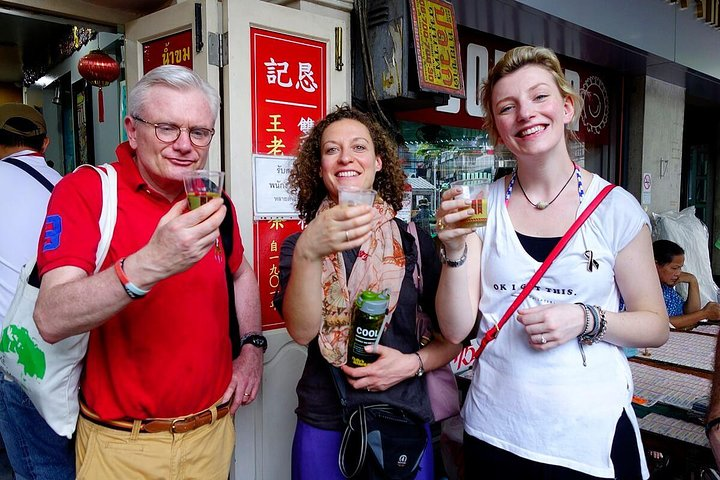 Experience the charm of Bangkok's Chinatown with delightful street food and secret herbal drinks exploring vibrant markets and stunning temples alongside fellow adventurers.