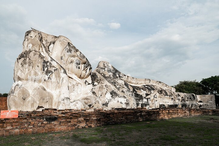 Experience the charm of Ayutthaya as you admire the impressive Reclining Buddha at Wat Lokayasutharam a perfect highlight on your funky frog tuk-tuk adventure. Immerse yourself in Thai heritage!