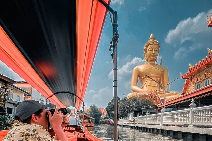 Explore the scenic canals of Bangkok while capturing timeless moments near majestic temples and serene waters discovering a hidden side of the city that feels untouched by time.