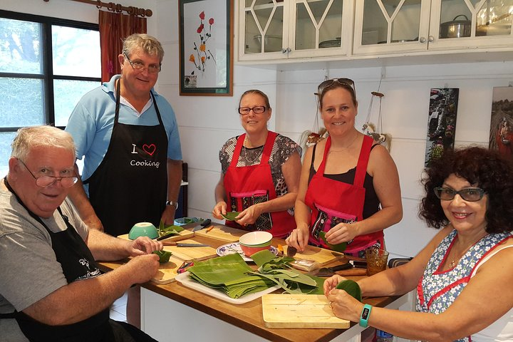 Experience the joy of cooking as you gather around with friends mastering traditional Thai dishes with expert guidance all while creating unforgettable memories in a welcoming kitchen setting.