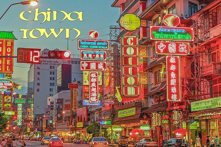 Experience the bustling streets of Bangkok's Chinatown where colorful neon signs illuminate wooden shop houses and the aroma of authentic street food fills the air creating a unique cultural tapestry.