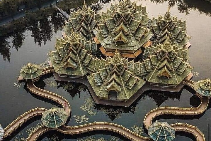 Experience the stunning architecture of Ancient City Bangkok featuring intricate designs surrounded by peaceful waters revealing the rich history and cultural heritage of Thailand’s diverse regions.