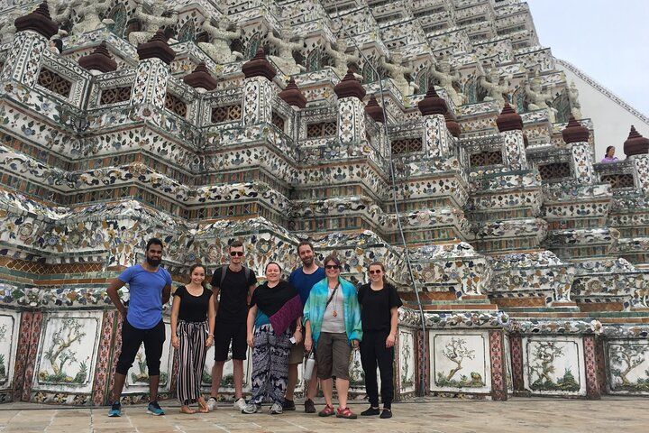 Explore Bangkok's stunning architecture and rich culture as you journey to iconic sites including the Temple of Dawn and the vibrant canals capturing the essence of local life.