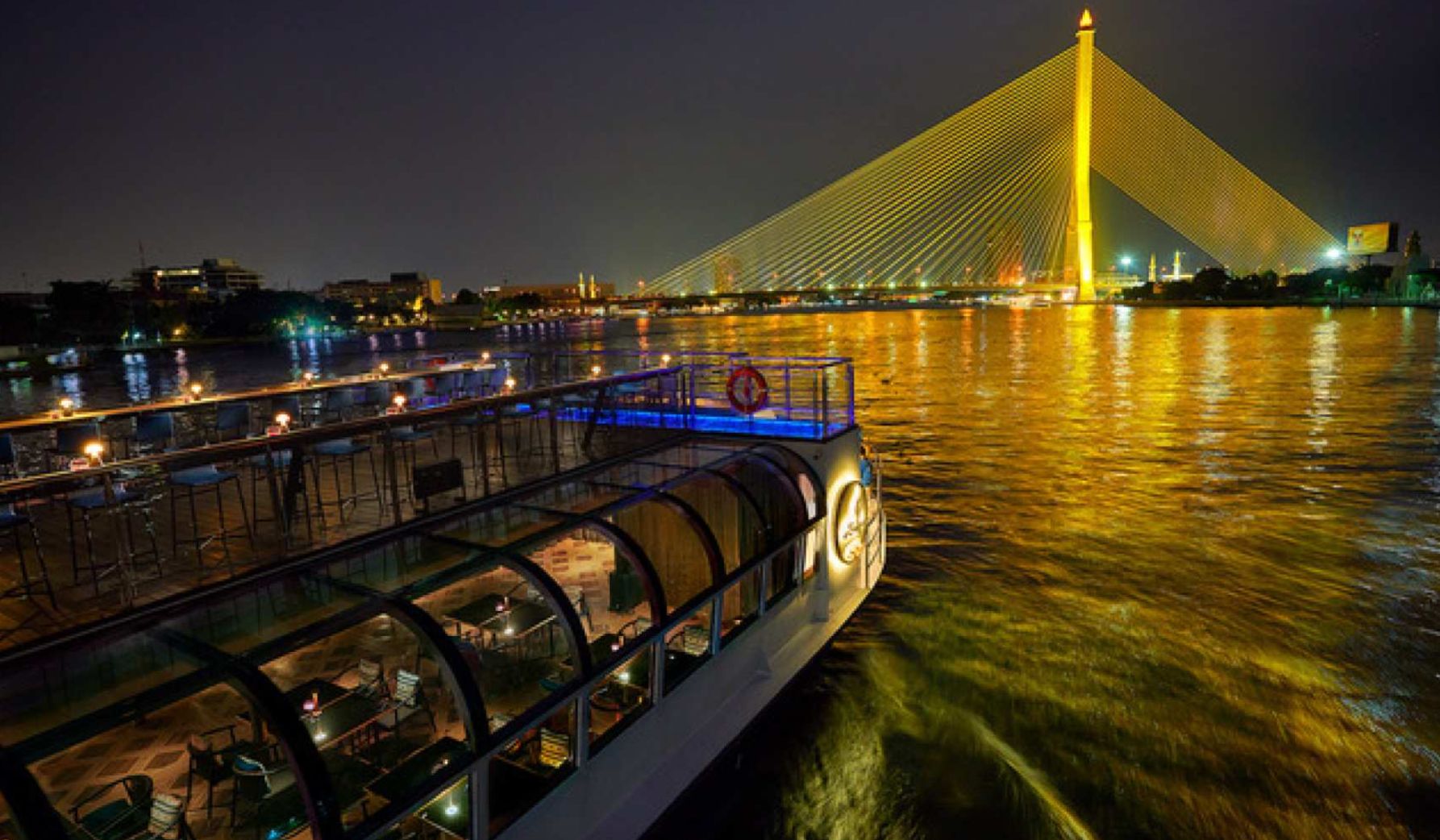 Sail along the Chao Phraya River indulging in a gourmet dinner while the stunning skyline of Bangkok twinkles overhead creating perfect memories with every culinary delight.