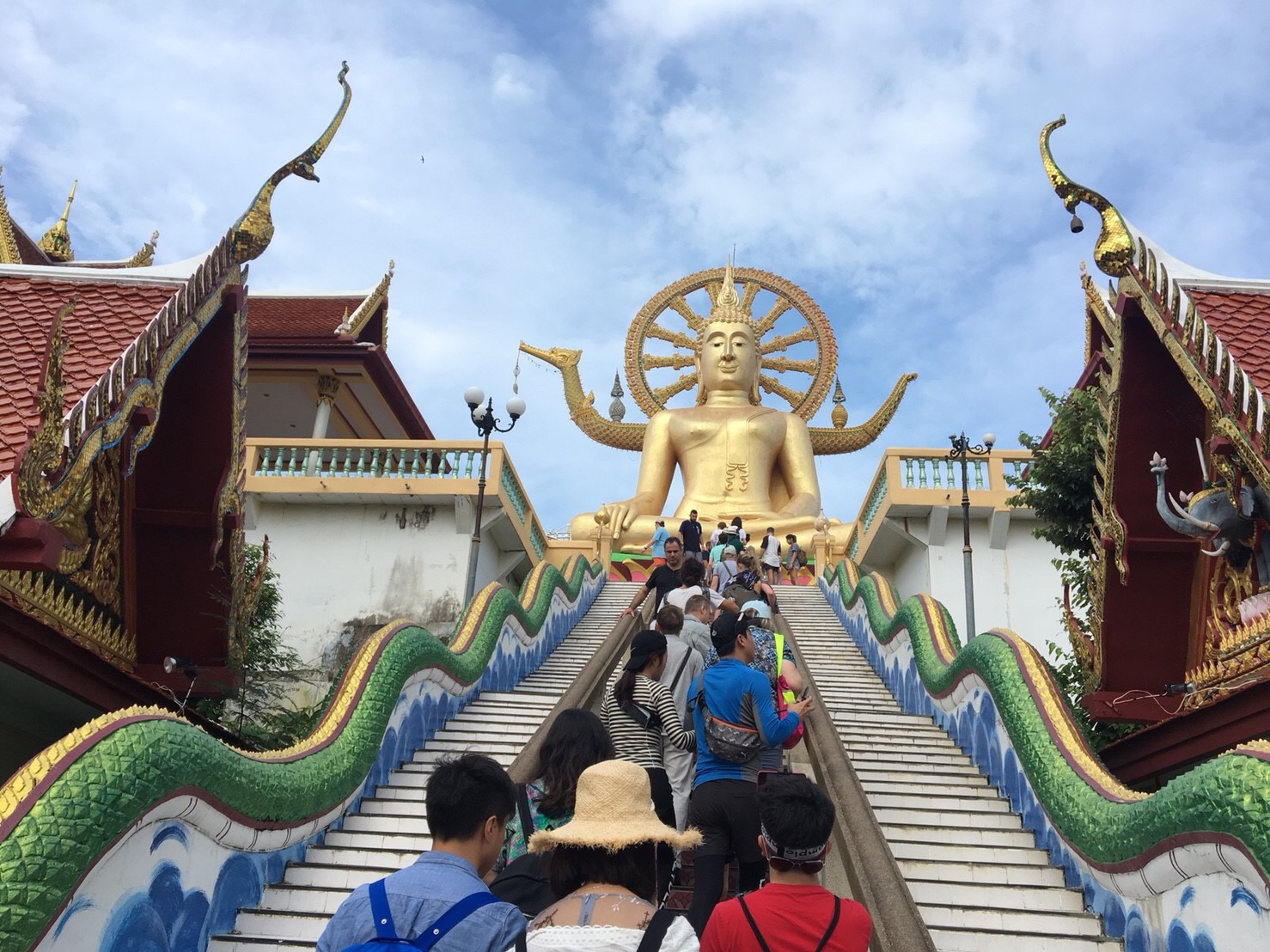 Ascending the steps to the Big Buddha reveals stunning views and a sense of connection to Koh Samui's rich culture inviting travelers to explore this remarkable landmark together.
