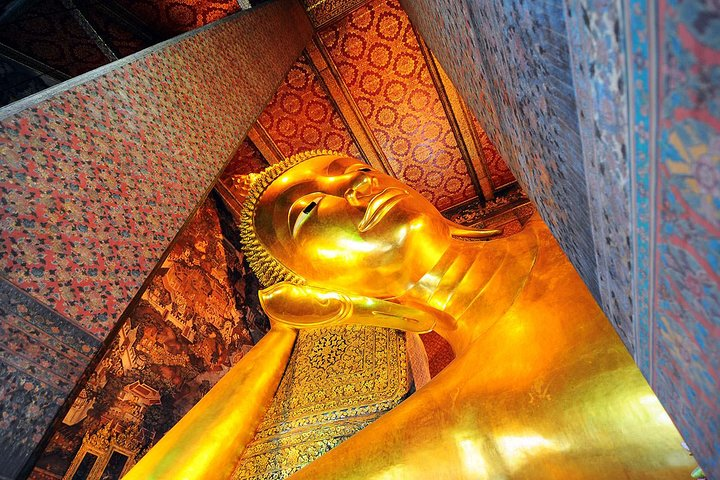 Discover the majesty of Wat Pho's Reclining Buddha a must-see on your journey through Bangkok's rich history and stunning sights. Experience the culture at every turn.