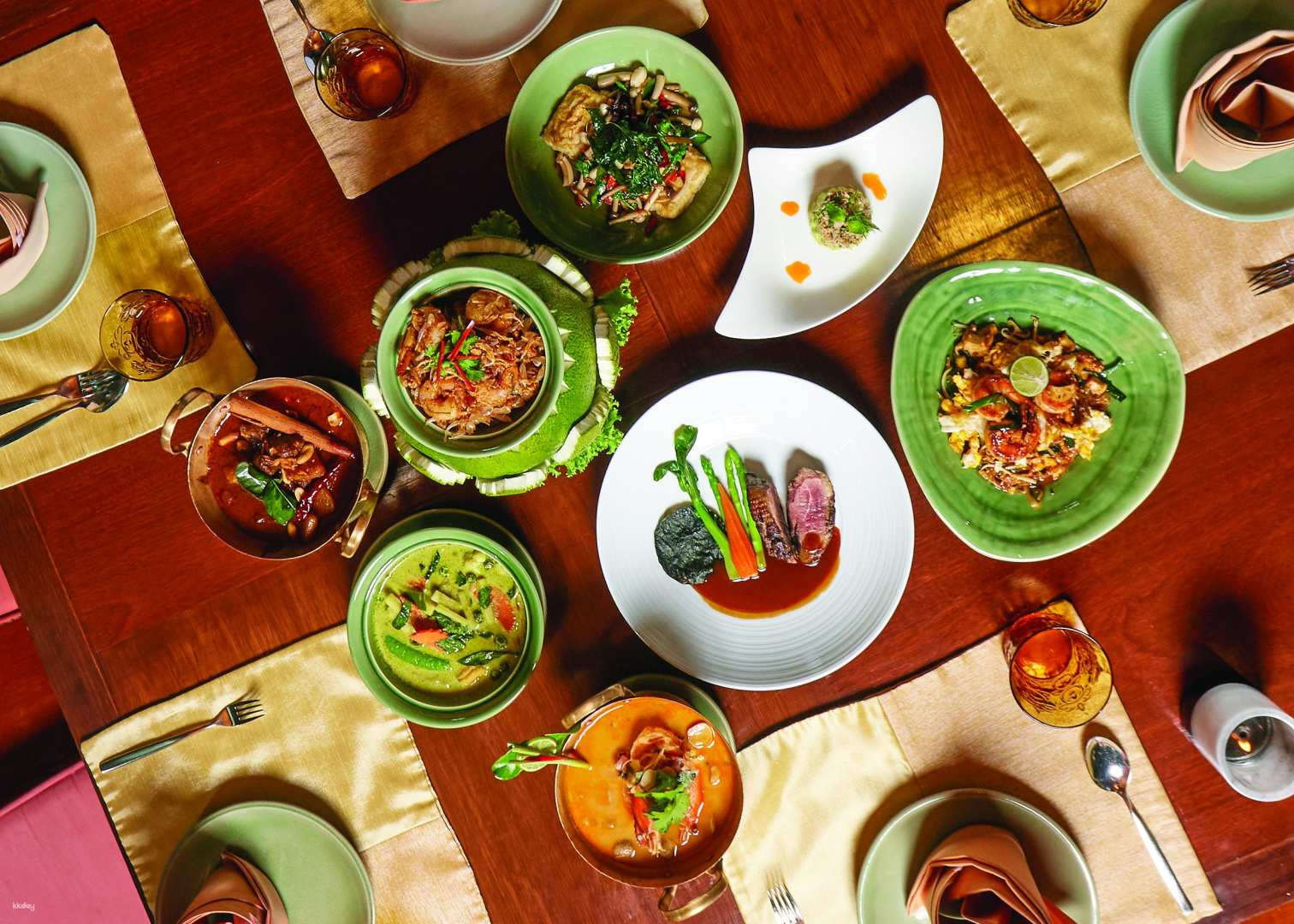 Indulge in authentic Thai dishes artfully crafted by Chef Burin Pongschang. Enjoy a unique dining experience surrounded by the elegance of traditional decor and stunning river views.
