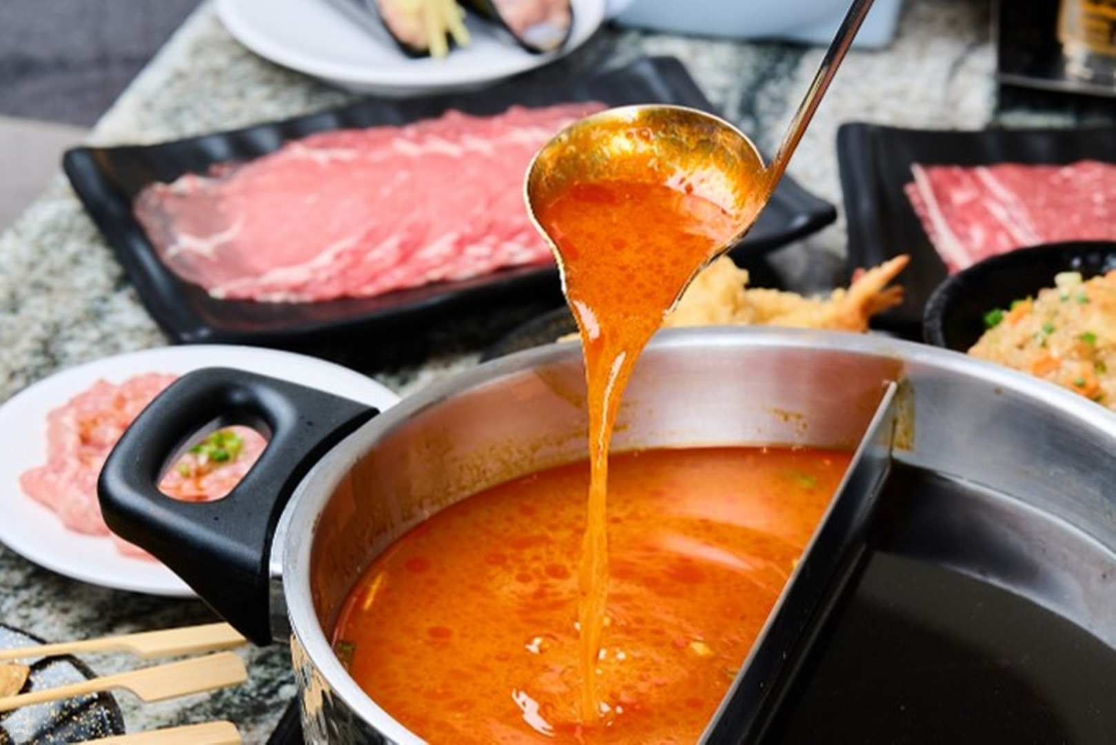 Savor the unique blend of Shabu Shabu and sushi in a bustling setting featuring fresh ingredients and delightful culinary experiences at Shabushi Buffet Mega Bangna Bangkok.