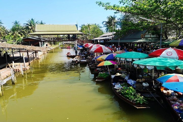 Experience the charm of a hidden floating market lined with colorful boats where local vendors offer fresh produce and unique goods an authentic taste of life in Thailand away from the crowds.
