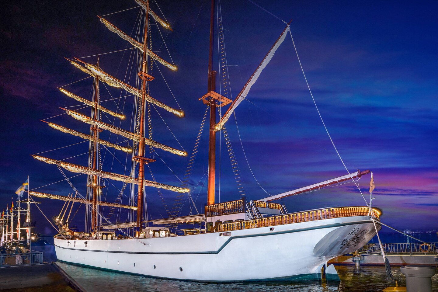 Step aboard the Sirimahannop Tall Ship Restaurant where every detail whispers stories of old Siam complemented by stunning river views and unforgettable culinary delights under the night sky.