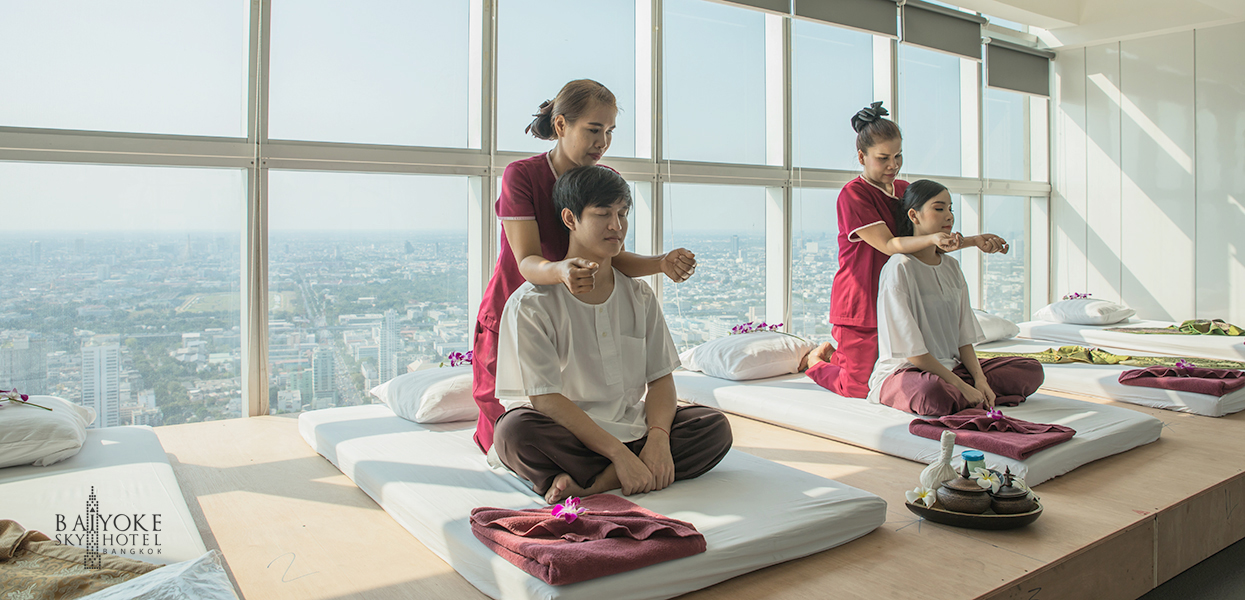 Indulge in a serene escape at Baiyoke Sky Hotel where expert therapists transform traditional Thai massage into a rejuvenating experience against the stunning skyline of Bangkok.