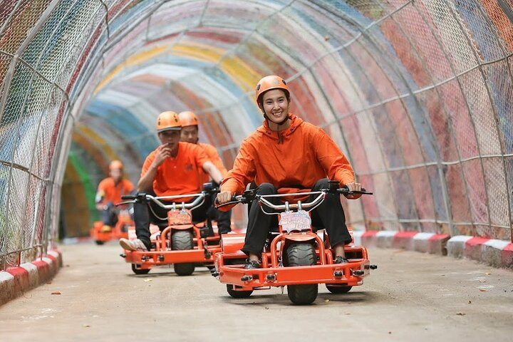 Experience the rush of gliding through a colorful tunnel on the Skyline Jungle Luge surrounded by stunning mountain views and the excitement of the longest zipline in Asia.
