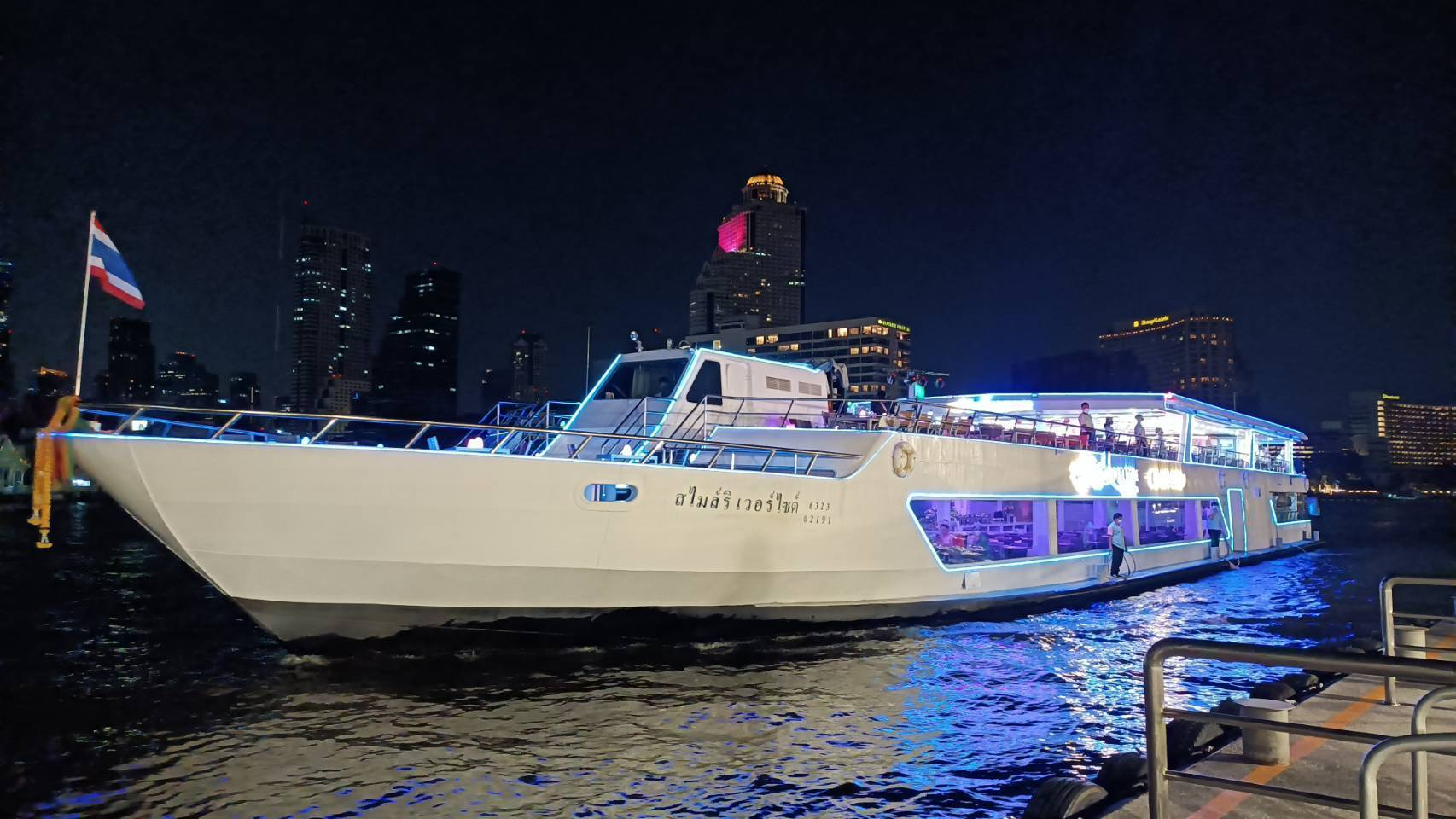 Experience the shimmering night views of Bangkok's skyline as you glide along the Chao Phraya River taking in landmarks like Wat Arun and the Grand Palace from the comfort of your cruise.