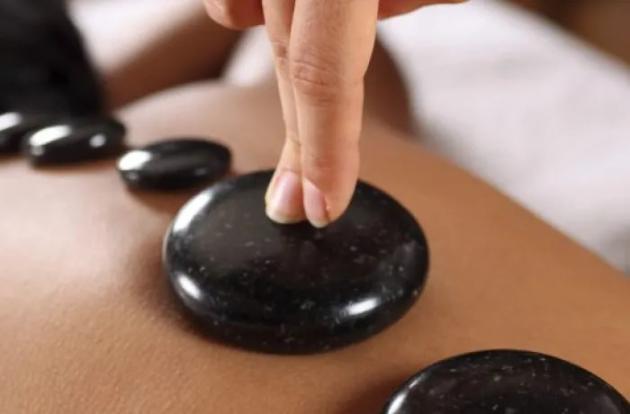 Experience the soothing touch of nature with a unique stone massage at Spa Cenvaree Centara Villas Samui where each treatment room reflects the beauty of the rainforest.