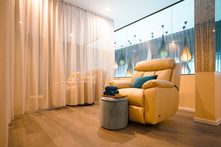 Relax in a serene space designed for rejuvenation where comfortable seating and soothing decor await for a blissful Thai massage experience after exploring Bangkok’s vibrant culture.