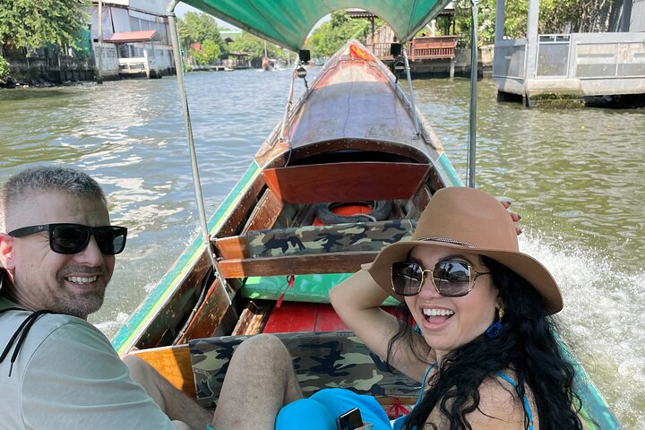 Experience the charm of Bangkok’s canals on a wooden boat exploring lush scenery local life and cultural sites like Wat Paknam and Baan Silapin—an adventure filled with discovery and fun.