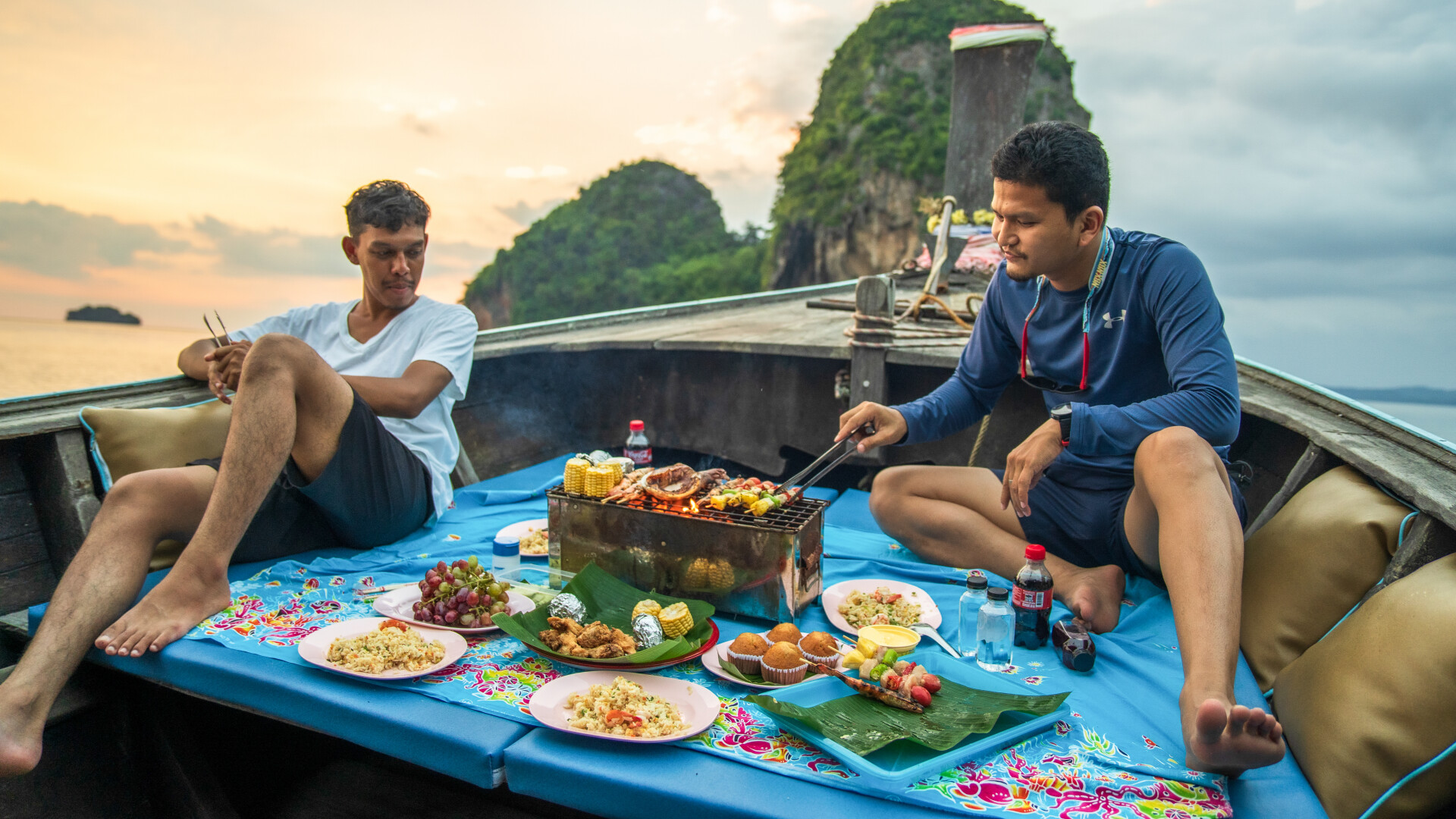 Savor a delicious barbecue while surrounded by breathtaking rock formations and the stunning sunset over Krabi’s islands creating unforgettable memories of your island-hopping adventure.