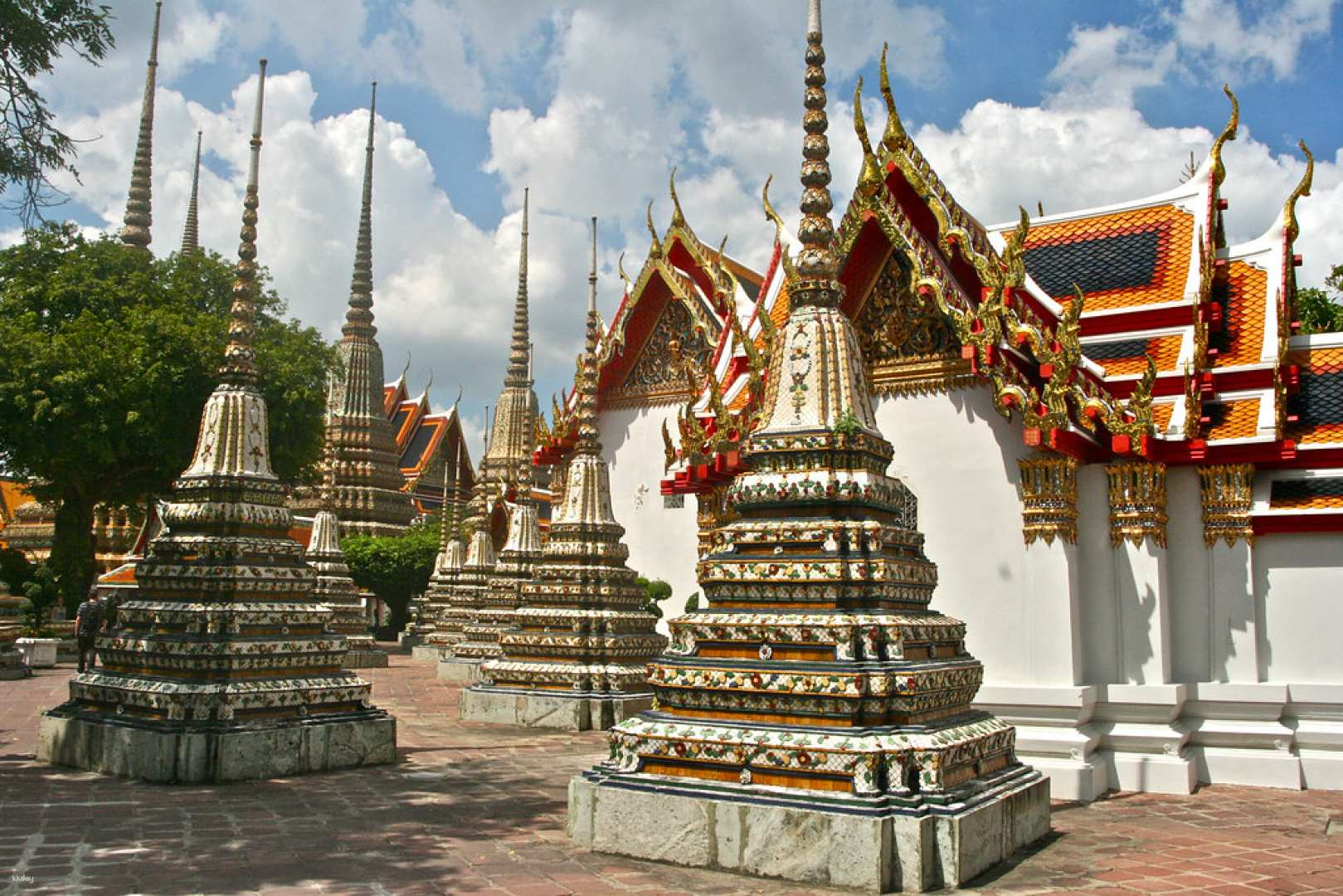 Explore the intricate architecture and serene surroundings of Wat Pho home to the iconic reclining Buddha. A perfect choice for travelers seeking a focused temple experience in Bangkok.