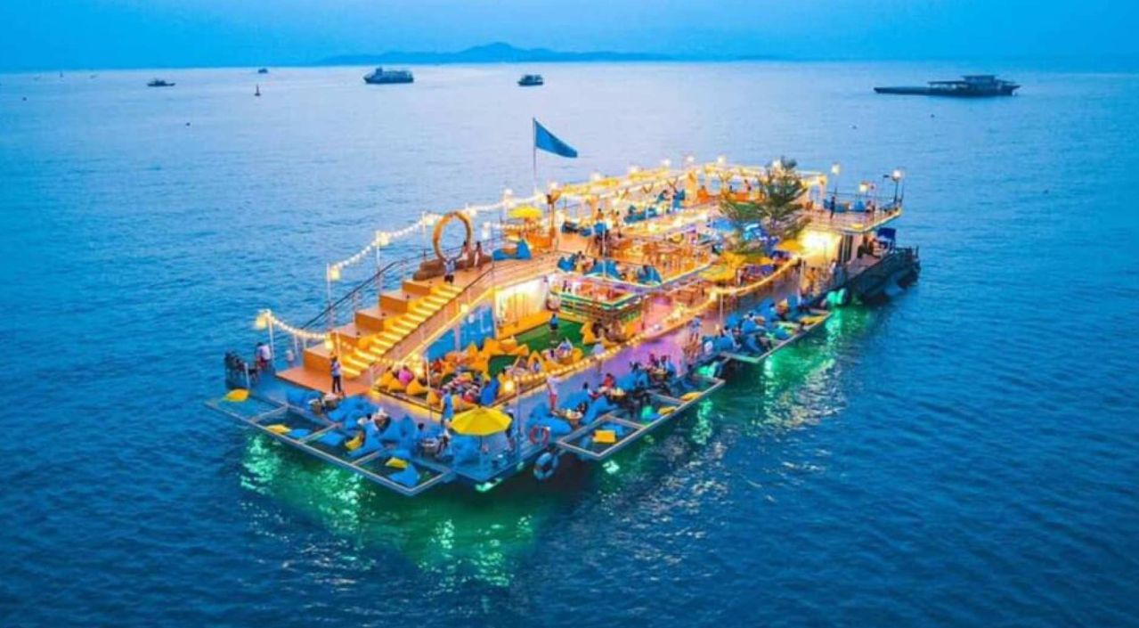 Experience the joy of dining on Tappia Floating Café where stunning ocean views enhance every bite ensuring a delightful outing with friends and family against a beautiful twilight backdrop.