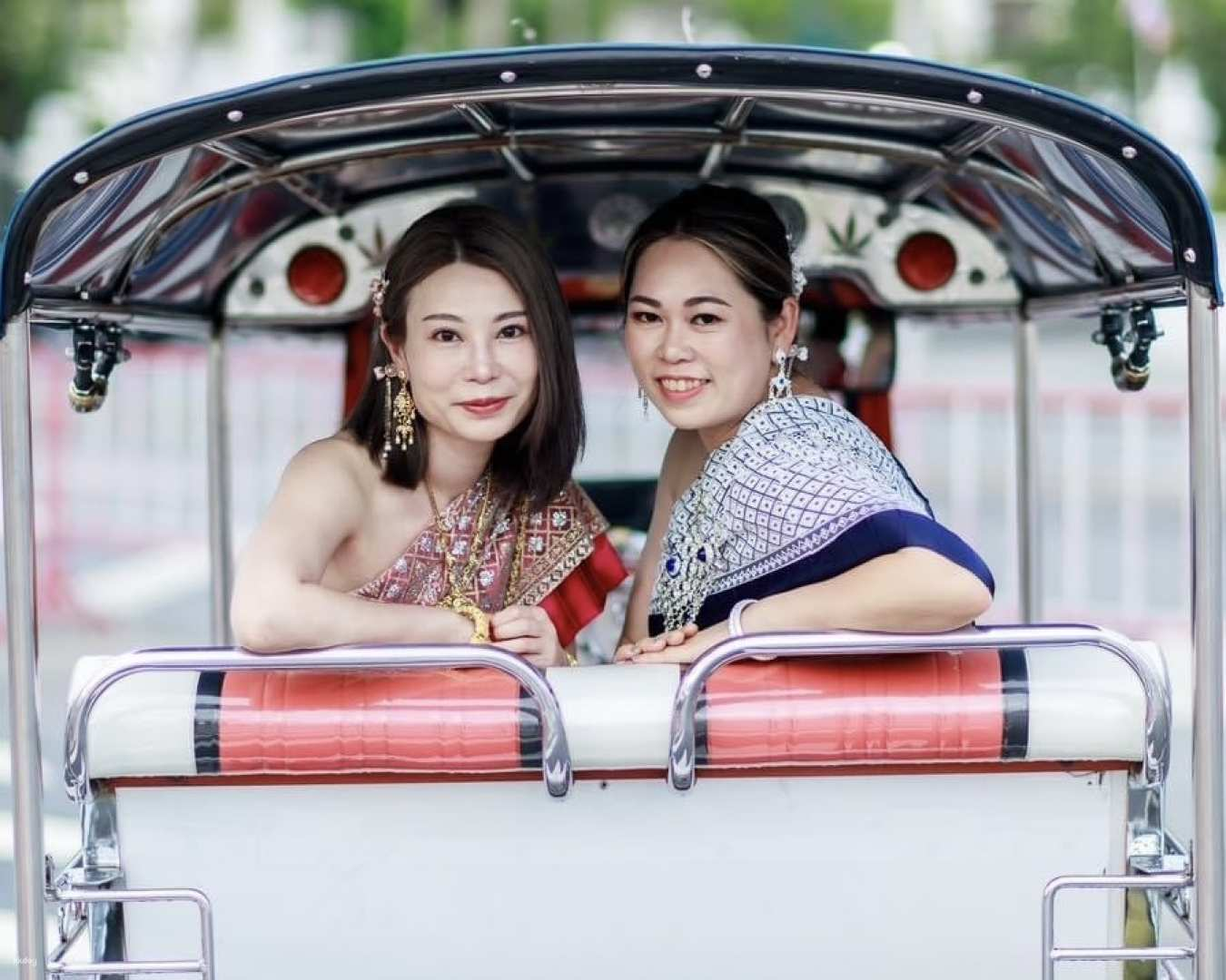 Immerse yourself in Thai culture as you don traditional costumes explore the city by tuk-tuk and create lasting memories with stunning photos and personalized services.