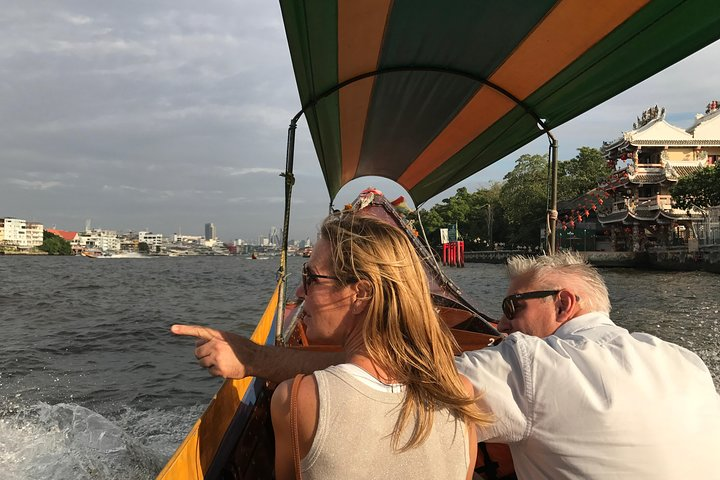 Experience the unique charm of Bangkok as you glide through scenic canals uncovering the city's rich history and culture while savoring delicious local flavors during your simple Thai lunch.