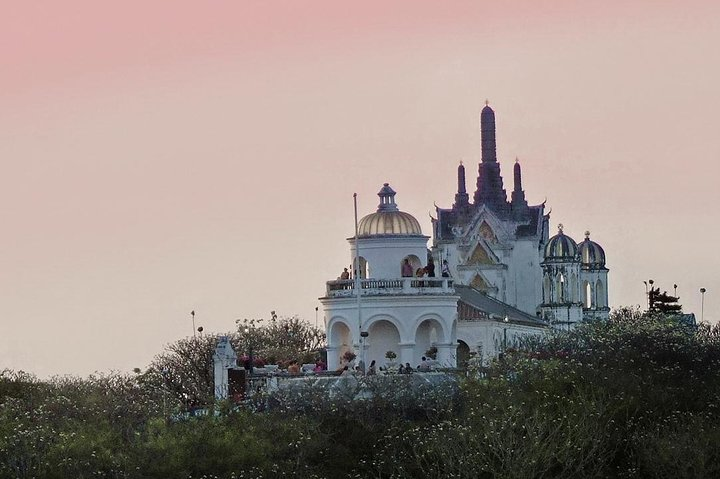 Experience the serene beauty of Phra Nakorn Khiri where stunning architecture meets lush greenery creating a perfect backdrop for exploration and reflection on your Thailand adventure.