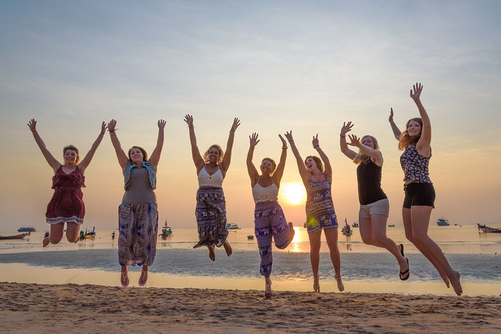 Experience the joy of travel with friends as the sun sets over stunning beaches creating unforgettable memories in Thailand's breathtaking landscapes. Embrace the adventure and fun of exploration!