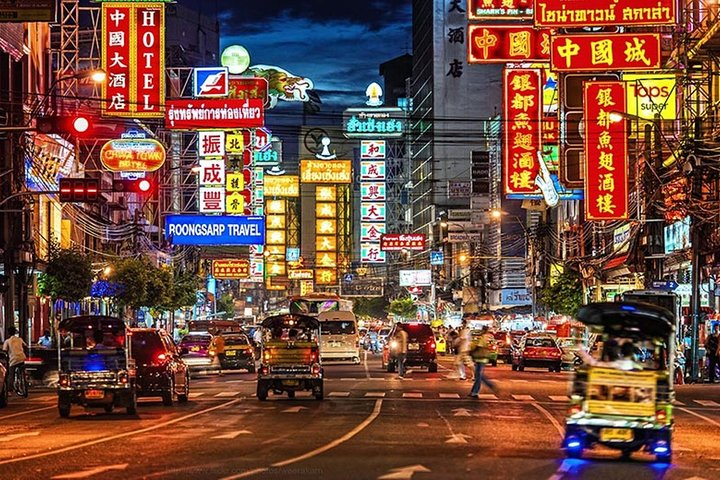 Experience the lively streets of Bangkok at night adorned with colorful lights and bustling traffic perfect for discovering the city's charms at your own pace with a customized tour.