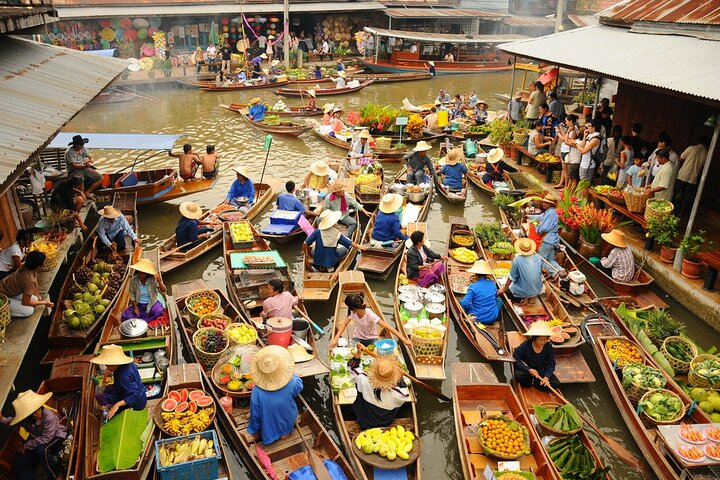 Experience the charm of floating markets where colorful boats brim with fresh produce and local delicacies creating a lively scene that showcases the essence of Thai culture.