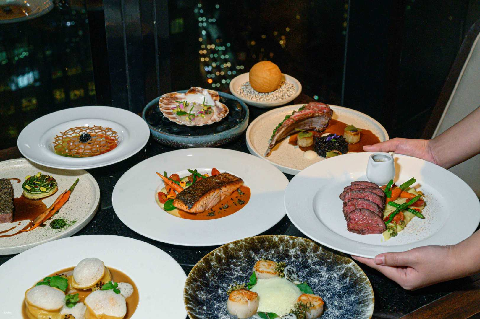 Indulge in a multi-course meal at Medinii Panorama Restaurant where European-inspired dishes meet stunning views of Bangkok perfect for a memorable dining experience.