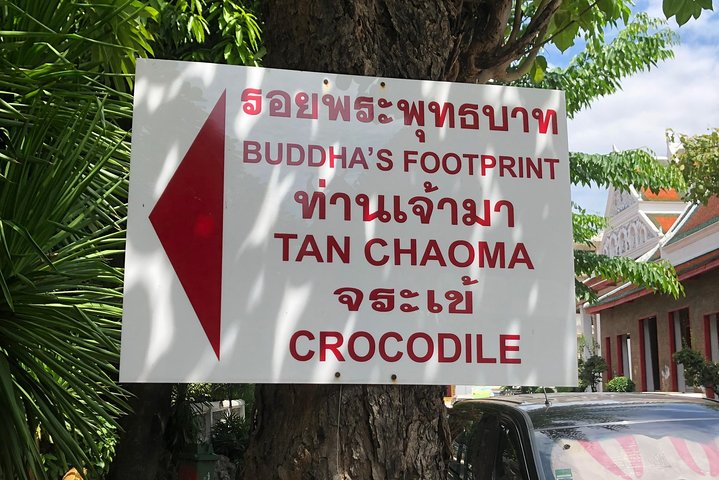 Explore hidden gems and unique sights on the Secrets of Bangkok Walking Tour including temples vibrant markets and a crocodile sanctuary all while savoring local flavors.