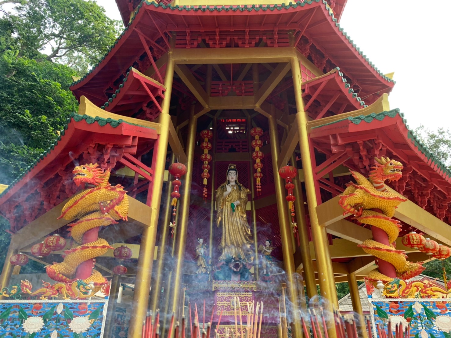 Explore the stunning architecture of Tiger Cave Temple surrounded by lush greenery before enjoying a refreshing swim in the crystal-clear Emerald Pool making your Krabi adventure unforgettable.
