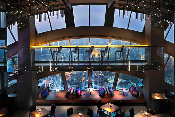 Enjoy stunning views and a chic lounge experience at Vertigo TOO Sky Bar where delightful drinks and live entertainment elevate your Bangkok evenings to a new level of indulgence.