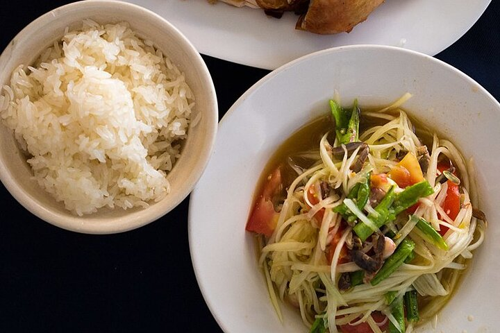 Experience the rich flavors of Bangkok with classic dishes like Pad Thai and Som Tum where each bite offers a glimpse into Thailand's culinary story amidst bustling street food stalls.