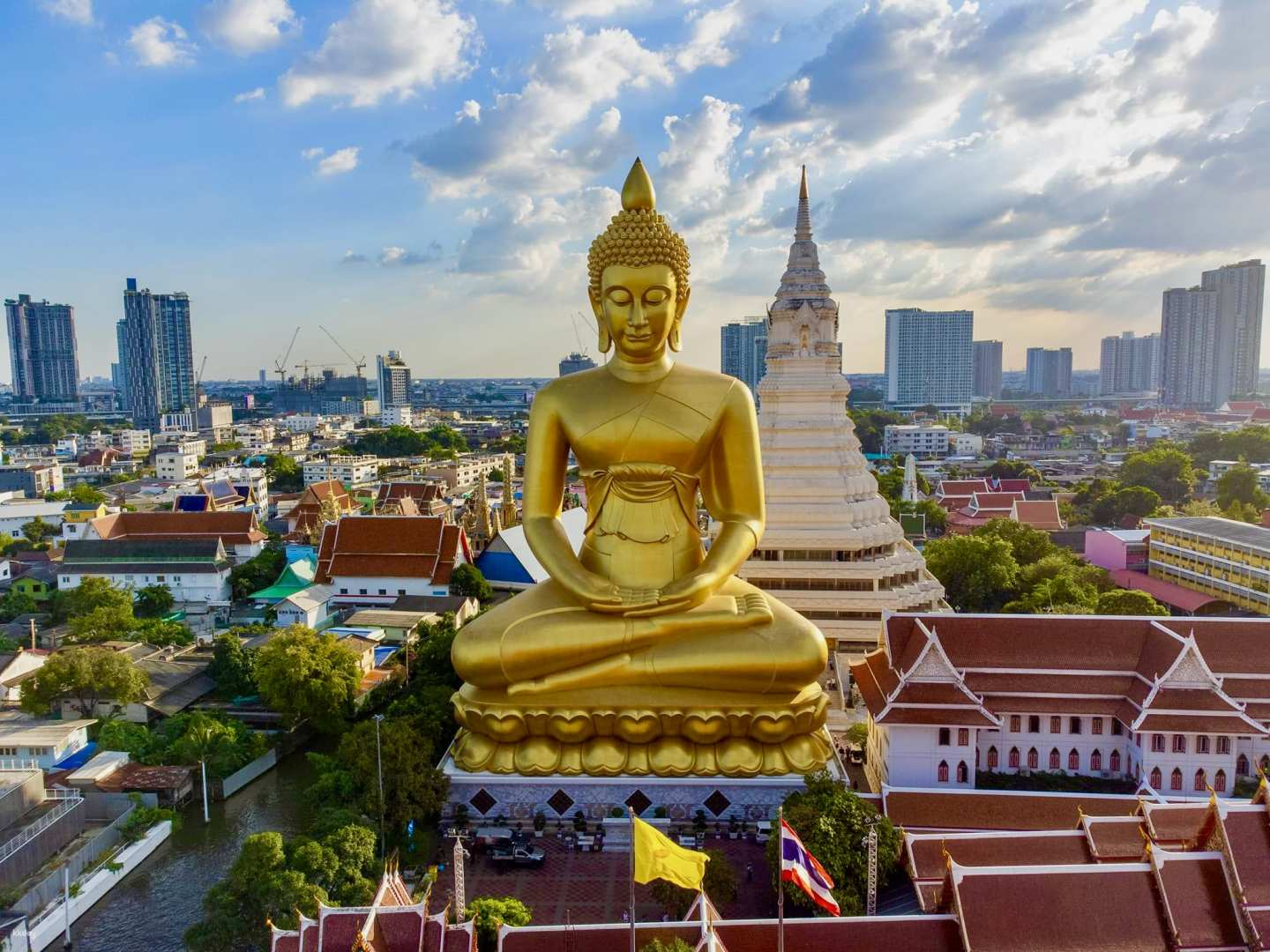 Experience the charm of Bangkok with stunning views from the Big Buddha leisurely coffee at After the Rain Cafe fresh seafood at Thonburi Market and traditional costumes at Wat Arun.