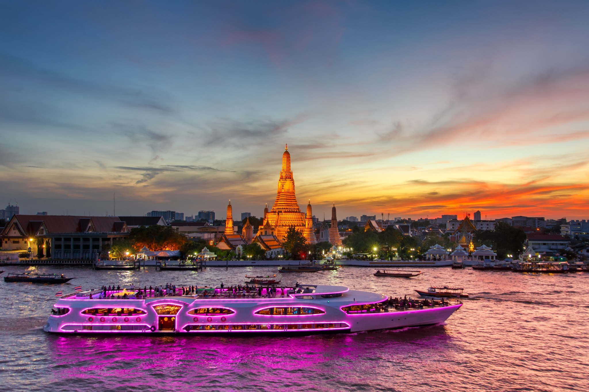 Experience the magic of Bangkok from the water savoring delicious cuisine as landmarks glow with sunset hues and live melodies fill the air on the Chao Phraya River.
