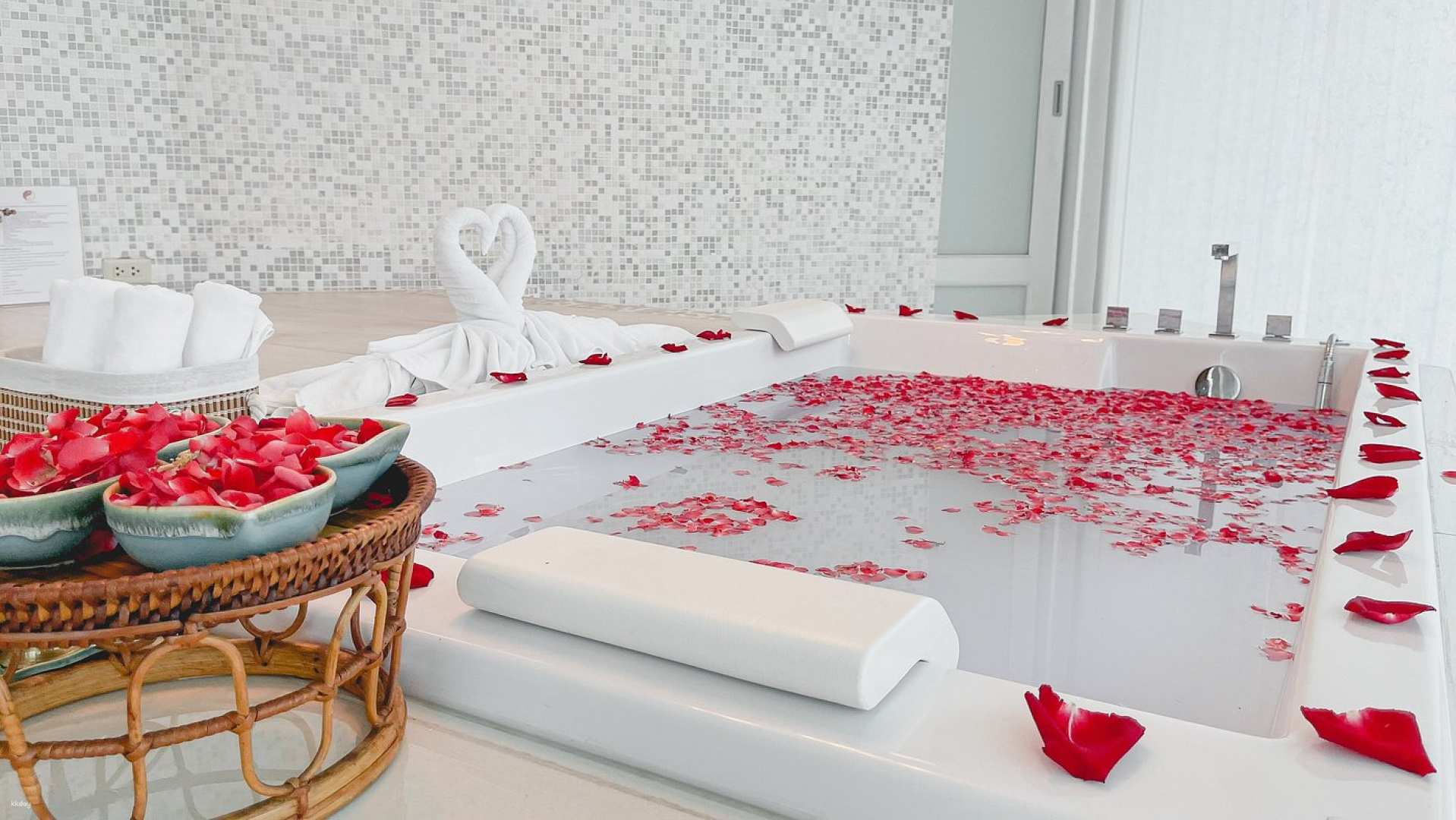 Indulge in tranquility with a luxurious spa retreat featuring a serene bath adorned with rose petals perfect for unwinding while embracing traditional healing techniques and restoring balance.